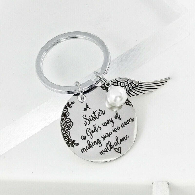 LAST DAY 49% OFF - A Sister is God's Way of Making Sure We Never Walk Alone Keychain