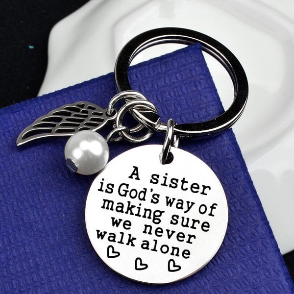 LAST DAY 49% OFF - A Sister is God's Way of Making Sure We Never Walk Alone Keychain