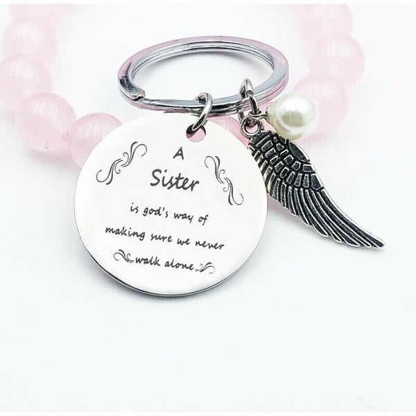 LAST DAY 49% OFF - A Sister is God's Way of Making Sure We Never Walk Alone Keychain