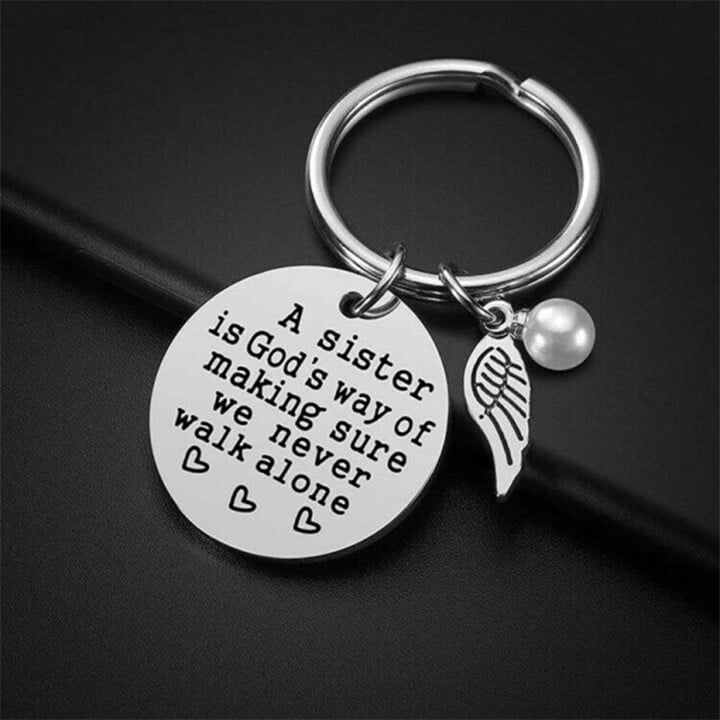 LAST DAY 49% OFF - A Sister is God's Way of Making Sure We Never Walk Alone Keychain